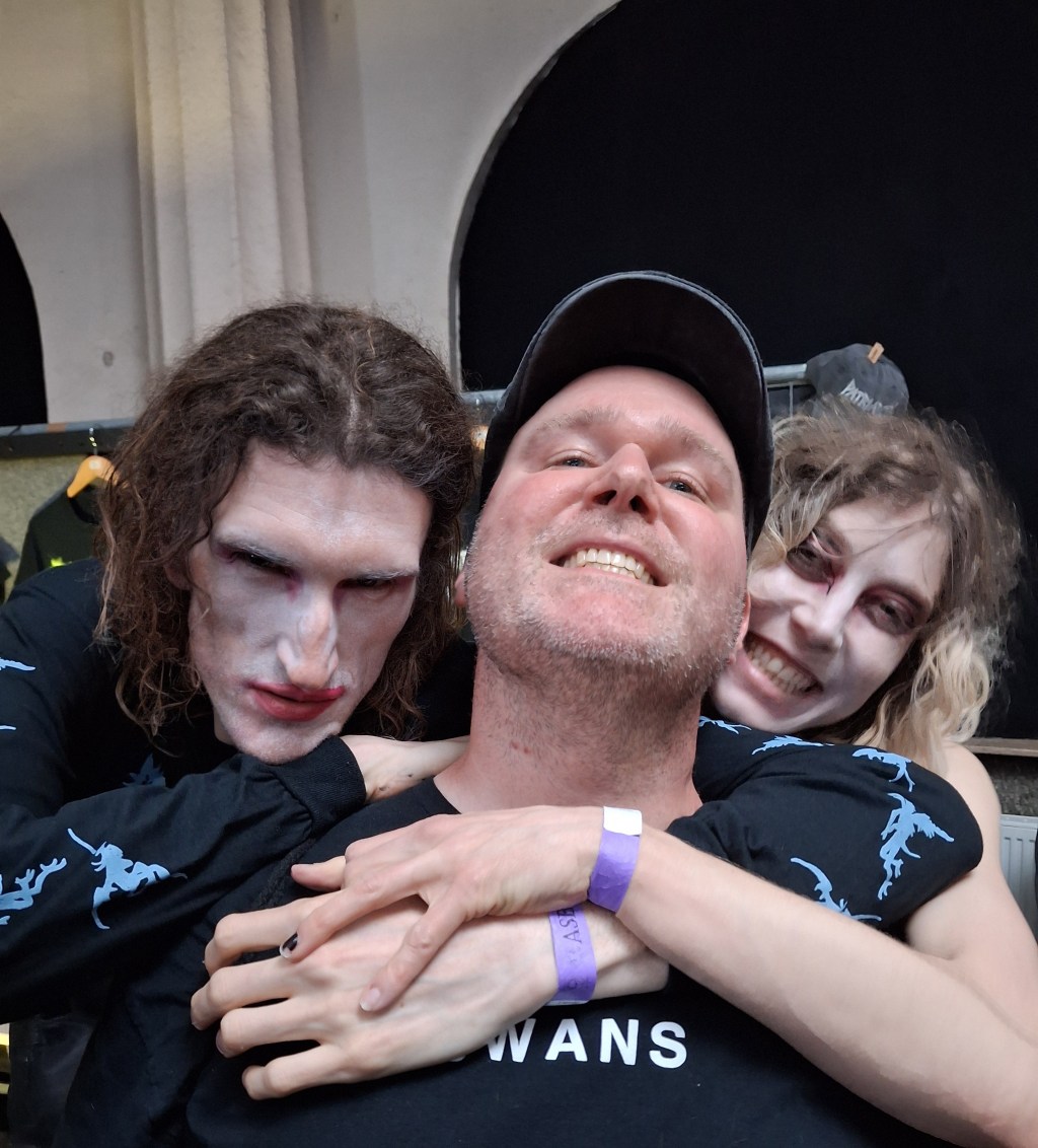 Jonny sandwiched between the kids from Patriarchy