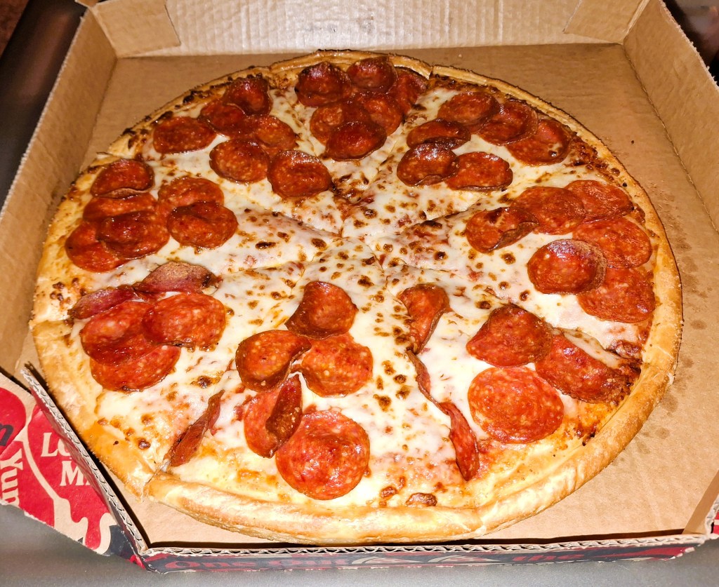 A delicious pepperoni pizza from Pizza Hut, ready for consumption!